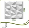 A white 3D wall panel with a geometric pattern, shown with dimensions indicated. Podgląd zdjęcia produktu