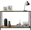 A console table with two shelves, displaying decorative items and books. Náhled obrázku produktu