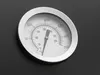A close-up of a thermometer on a dark surface. Produktbild-Vorschau