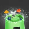 A close-up shot of a portable blender with fruits and water splashing around it. Náhled obrázku produktu