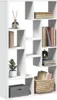 A white, multi-compartment shelving unit filled with books, a plant, a decorative diffuser, and a woven basket. Náhled obrázku produktu