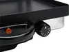 A close-up shot of a black electric grill's control knob and handle. Náhľad obrázku produktu