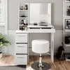 A white vanity table with a mirror, drawers, and a stool, set in a well-lit room. Náhled obrázku produktu