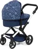 A navy blue and white patterned doll stroller is shown against a white background. Produktbild-Vorschau