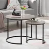 A living room setting with two nesting coffee tables, a sofa, and decorative items. Produktbild-Vorschau