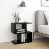 A black bedside table with books and decorative items next to a bed. Podgląd zdjęcia produktu