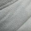 A close-up view of a textured beige fabric, likely upholstery for furniture. Produktbild-Vorschau