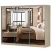 A mirrored sliding door wardrobe reflecting a bedroom scene. Voir les images du produit