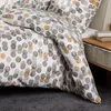 A close-up view of a duvet cover with a polka dot pattern. Produktbild-Vorschau