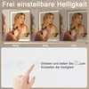 A collage showing a woman using a lighted makeup mirror at different brightness levels, with instructions on how to adjust the brightness. Anteprima dell’immagine prodotto