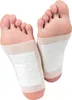 Two feet with detox pads applied to the soles. Produktbild-Vorschau
