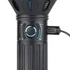 Close-up of the charging port and battery indicator lights on a black flashlight. Podgląd zdjęcia produktu