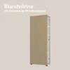 A tall, narrow display cabinet with a solid front panel and visible shelves on the side, set against a plain background. Náhled obrázku produktu