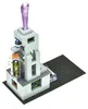 A Lego construction set with a tower structure and a purple translucent piece on top, placed on a black Lego baseplate. Podgląd zdjęcia produktu