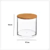 A clear studio shot of a cylindrical clear container with a bamboo lid, with dimensions indicated. Náhled obrázku produktu