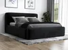 A black upholstered bed with gray bedding and pillows, placed on a gray rug in a room with artwork on the wall and a plant near a window. Produktbild-Vorschau