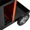 A close-up view of a black metal cart with an orange interior and a wheel. Produktbild-Vorschau