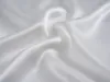 A close-up view of white silk fabric, showing its texture and folds. Podgląd zdjęcia produktu