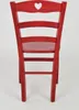 The back view of a red wooden chair with a heart cutout in the top. Podgląd zdjęcia produktu