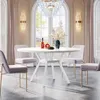 A dining room scene with a round white table and four light purple chairs. Náhled obrázku produktu