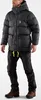 A man wearing a black puffer jacket and black pants, standing against a white background. Produktbild-Vorschau