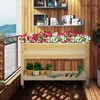 A wooden raised garden bed filled with red and white flowers, placed on a wooden deck with gardening tools and small potted plants on a lower shelf. Produktbild-Vorschau
