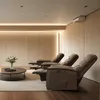 A modern living room or home theater with three reclining chairs, a coffee table with a vase of flowers, and ambient lighting. Anteprima dell’immagine prodotto