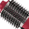 A close-up view of the bristles and barrel of a round hairbrush. Voir les images du produit