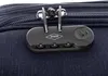 A close-up view of a combination lock on a dark blue fabric suitcase. Náhled obrázku produktu