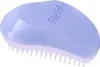 A lilac and white Tangle Teezer hairbrush is shown from a slightly elevated side angle against a white background. Produktbild-Vorschau