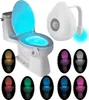 A toilet with a motion-activated LED light that changes colors, shown with multiple color options. Voir les images du produit
