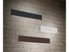 Three modern wall lights mounted on a brick wall. Náhľad obrázku produktu