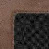 A close-up view of the corner of a rug, showing the textured fabric and the non-slip backing. Produktbild-Vorschau