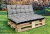 A grey cushion set on a wooden pallet sofa in a garden setting. Produktbild-Vorschau