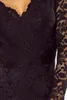 A close-up view of a black lace dress. Náhled obrázku produktu