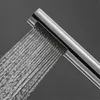 A close-up shot of a silver shower head spraying water. Produktbild-Vorschau
