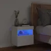 A white floating nightstand with blue LED lights is next to a bed. Produktbild-Vorschau