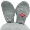 Close-up of a plush toy's ears with a "Press Here" button. Náhled obrázku produktu