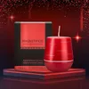 A red scented candle and its packaging are displayed on a red platform against a dark background with red glitter. Anteprima dell’immagine prodotto