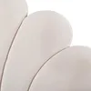 A close-up view of a beige upholstered bed frame with a scalloped or floral design. Náhľad obrázku produktu