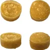 Four round, light brown dog treats are shown against a white background. Two treats are shown from the side, revealing a soft, textured interior. The other two treats are shown from the top, with a smooth, slightly speckled surface. Produktbild-Vorschau