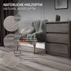 A room setting with flooring, a chair, and a dresser, showcasing the product's wood-like appearance. Podgląd zdjęcia produktu