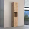 A tall, narrow wooden cabinet stands against a light gray wall, with a window showing a landscape in the background. Produktbild-Vorschau