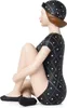A figurine of a woman in a vintage swimsuit and cap, sitting with her legs crossed. Anteprima dell’immagine prodotto
