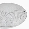 A close-up, angled view of a round, textured glass ceiling light fixture with a decorative pattern. Produktbild-Vorschau