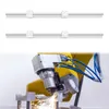 Two linear guide rails are shown above a robotic arm with a cutting tool, sparking as it works on a metal object. Náhled obrázku produktu