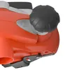 A close-up view of a power tool, likely a planer, showing a black adjustment knob and part of the orange body. Produktbild-Vorschau