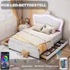 A bedroom scene featuring a white LED bed frame with storage drawers, styled with bedding and pillows. Náhľad obrázku produktu