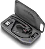 A black Plantronics Voyager 5200 headset and its accessories are neatly arranged in a charging case. Produktbild-Vorschau