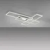 A modern, geometric LED ceiling light fixture mounted on a gray ceiling. Produktbild-Vorschau